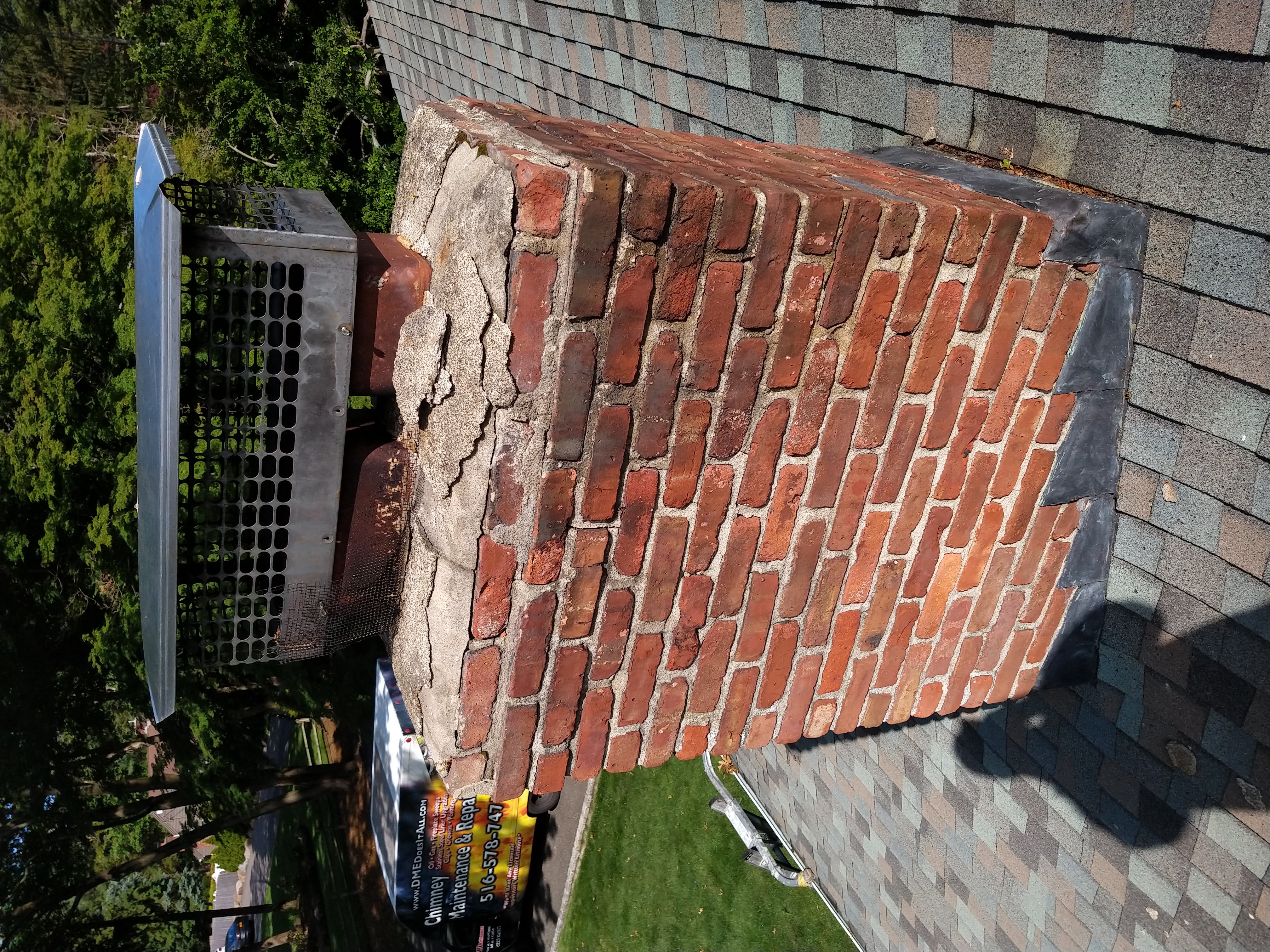 AN OLD, RUSTED CHIMNEY CAP THAT NEEDS TO BE REPLACED IN FARMINGDALE