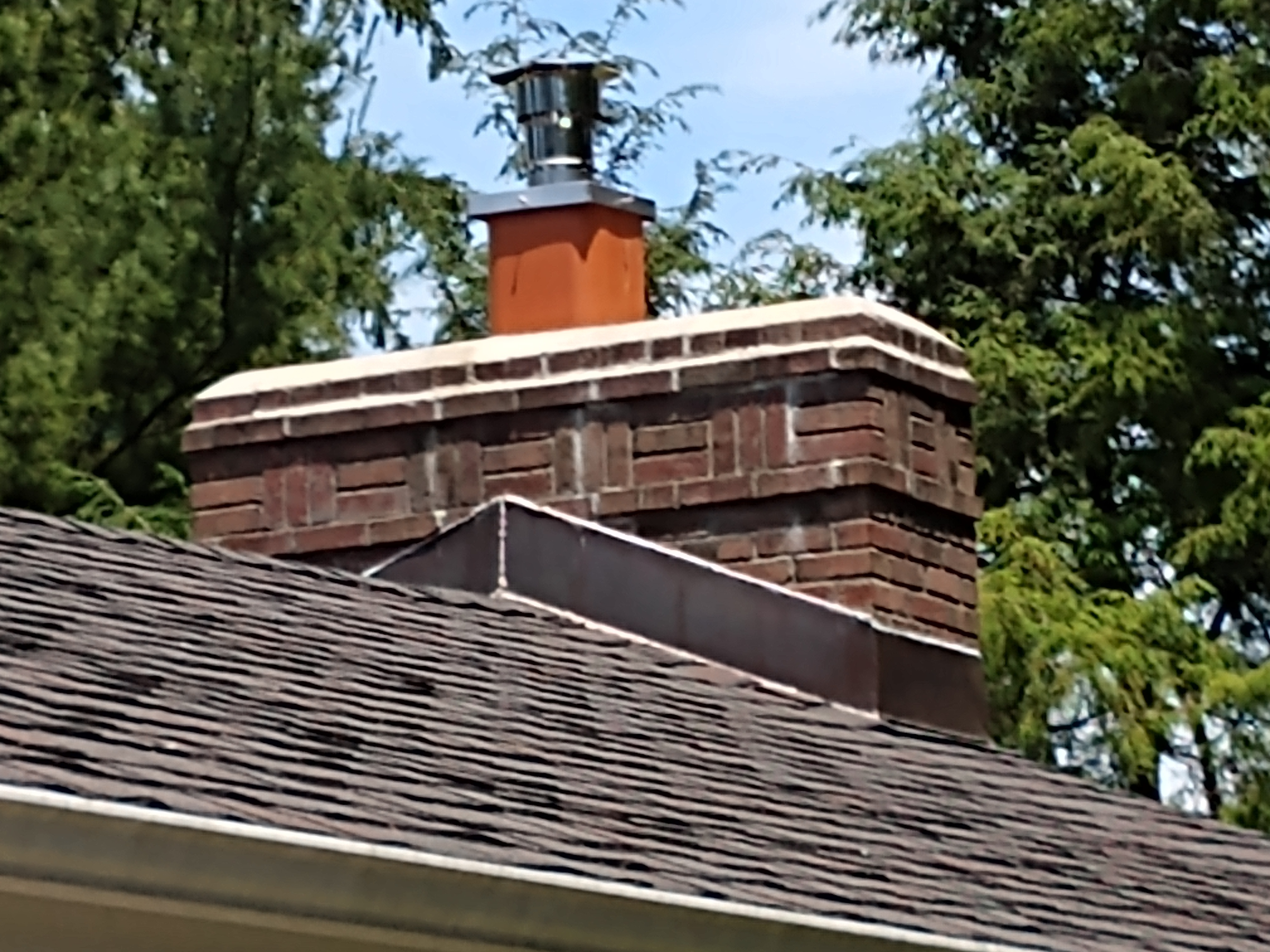Stainless steel chimney cap with animal guard in Farmingdale, New York